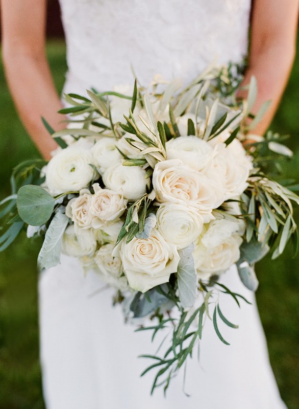 A neutral wedding bouquet with lush blooms, greenery and eucalyptus for a fresh and simple look