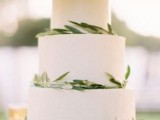 a white wedding cake decorated with olive greenery is a perfect idea for a Tuscany wedding