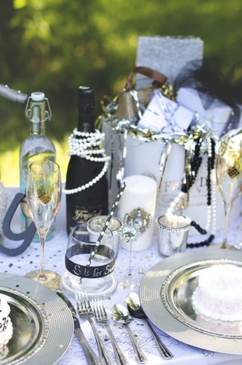 a glam champagne bottle wrapped with pearls is a cool idea to accent the bottle and make it chic