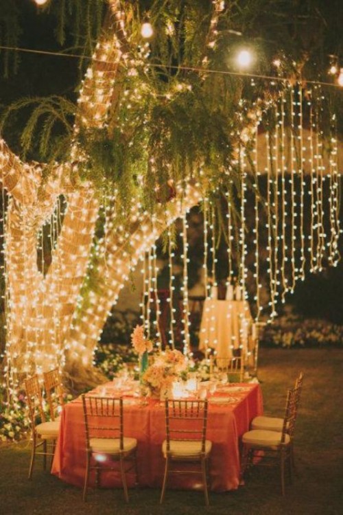 curtains and canopies of string lights make your wedding reception space much cooler, cozier and lovelier and create a cool ambience