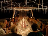 string lights as a canopy over the wedding reception are a great idea for cozying up the space and illuminating it at the same time