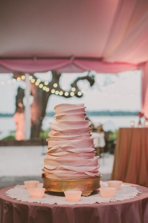 a blush ruffle wedding cake is a beautiful and stylish idea to rock for a modern wedding, perhaps with a rustic feel