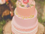 a lovely summer wedding cake in different shades of pink