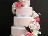 a light pink wedding cake with silver ribbons, with white, coral and dark blooms is an exquisite and bold idea for any wedding
