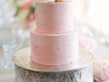 a textural pink wedding cake topped with a large white bloom is a perfect solution for a spring or summer wedding, it’s beautiful and elegant
