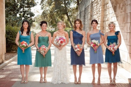mismatched knee bridesmaid dresses in green and blue are nice for a seaside or beach wedding