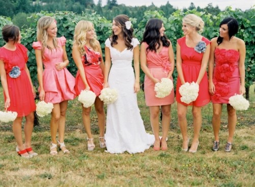 mismatched red and pink knee bridesmaid dresses with ruffles and draperies are nice for summer