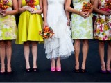 mismatched floral and bright bridesmaid dresses are nice for a colorful summer or spring wedding