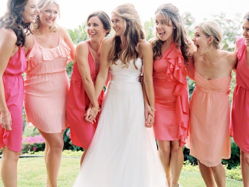 Light pink and bright pink short bridesmaid dresses with ruffles are nice for a colorful summer wedding