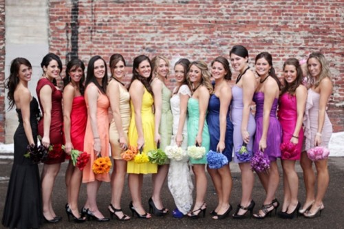 bright mismatching bridesmaid dresses in all the colors of rainbow for a colorful wedding in summer