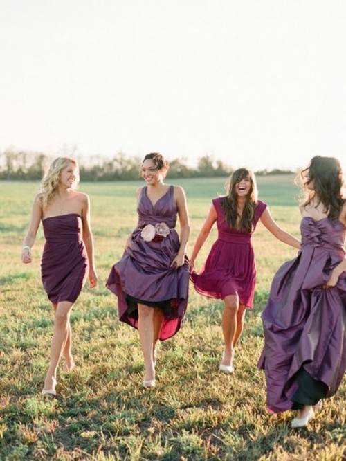 purple and fuchsia bridesmaid dresses of various lengths and designs are nice for a sumptuous fall wedding