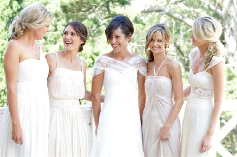 Mismatched white bridesmaid dresses of various designs are chic and trendy, for spring and summer nuptials