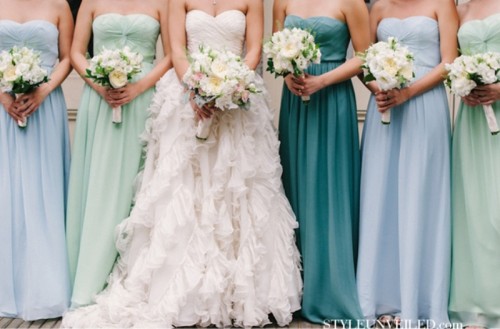 mismatching strapless maxi bridesmaid dresses in greens and blues are amazing for a seaside wedding