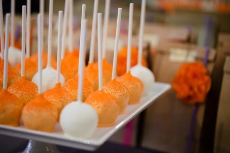 white and orange cake pops like these ones will be the best solution for a colorful summer or fall wedding