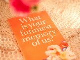 an orange card letting your guests to leave their memories about you as a couple