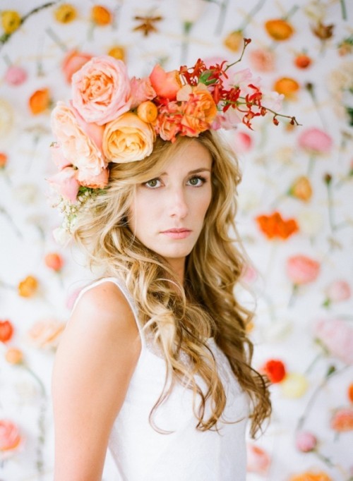a super lush wedding crown of pink and orange roses, peony roses and bold leaves is amazing for summer or fall