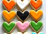 heart-shaped sugar cookies covered with colorful glazing are amazing for a modern wedding with pops of color