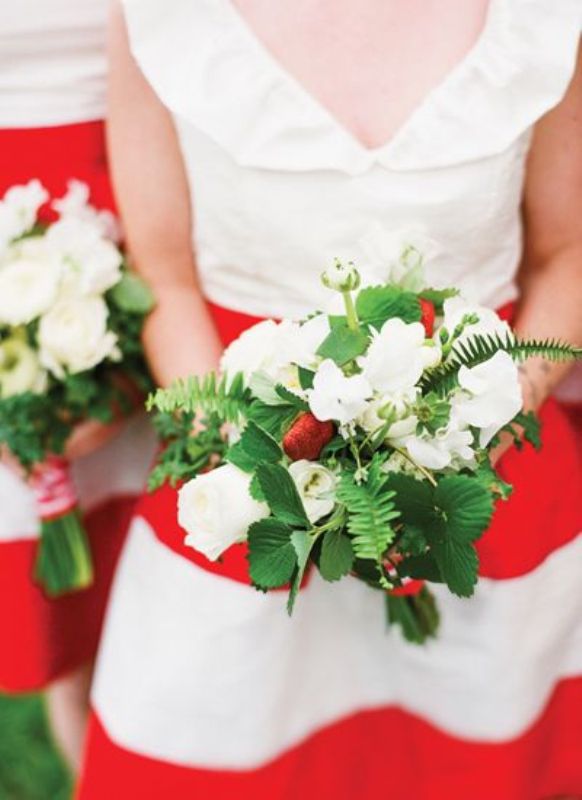 Red and white striped bridesmaid dresses and green, white and red bouquets to rock at a winter or Christmas wedding