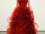 a strapless red A-line wedding dress with a ruffled skirt of layers is a stylish idea for a modern winter wedding