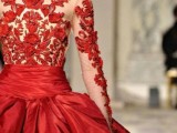 a red wedding ballgown of an illusion lace bodice and a full shiny skirt is a stunning solution for a winter or Christmas bride