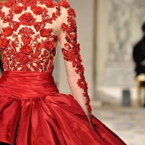 A red wedding ballgown of an illusion lace bodice and a full shiny skirt is a stunning solution for a winter or Christmas bride