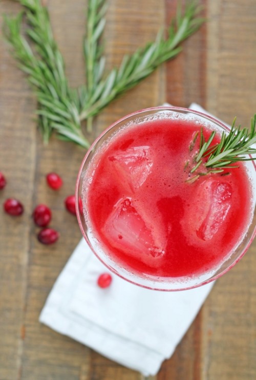 cranberry punch topped with rosemary is a great signature drink for a winter or Christmas wedding