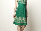 a green bridesmaid dress with gold embroidery and red shoes for a winter or Christmas wedding