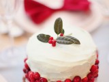 a winter wedding cake decorated with berries, leaves is an amazing winter or Christmas wedding dessert