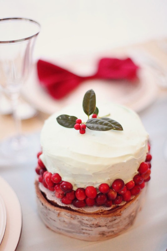 A winter wedding cake decorated with berries, leaves is an amazing winter or Christmas wedding dessert