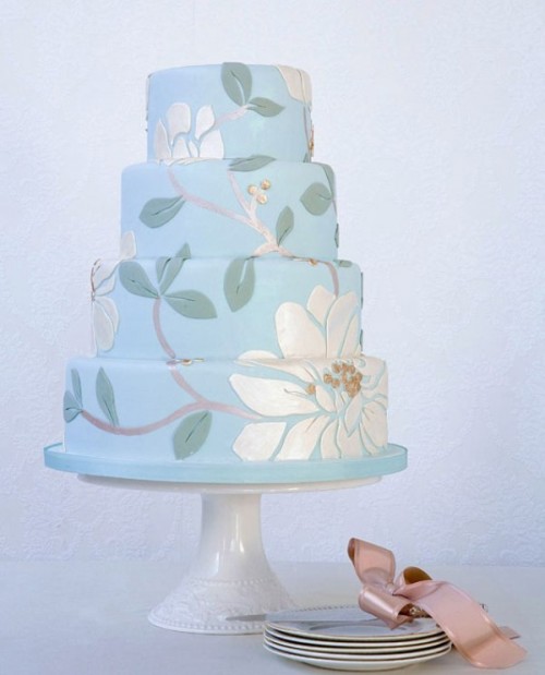 a serenity blue wedding cake with sugar botanical patterns and blooms is a lovely idea for a spring or summer wedding