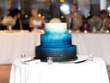a beautiful ombre wedding cake from white to bold blue and midnight blue is a stylish and cool idea for a chic and bright wedding