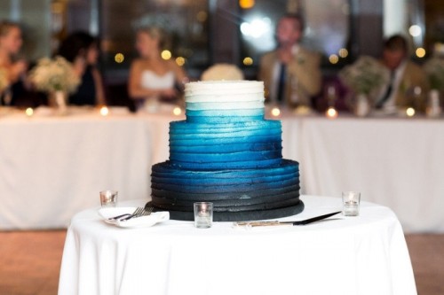 a beautiful ombre wedding cake from white to bold blue and midnight blue is a stylish and cool idea for a chic and bright wedding