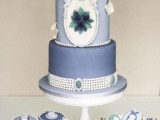 an exquisite light blue and bright blue wedding cake with a gorgeous vintage design, with sugar pearls and beads, with sugar and fresh blooms for a vintage wedding