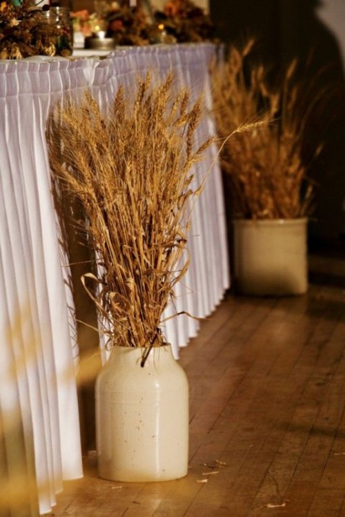 porcelain vases with wheat can line up the aisle or tables to make your space feel cozy and very rustic
