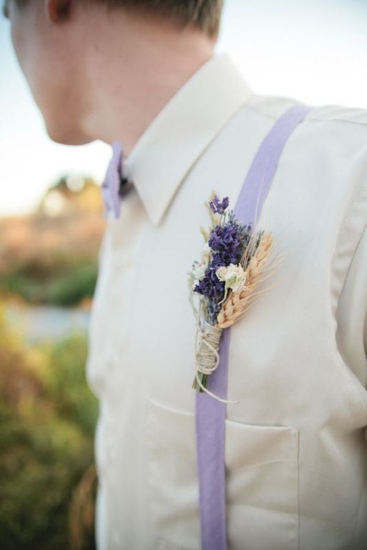 A pretty rustic wedding boutonniere with wheat and dried blooms for a summer to fall or fall wedding