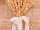a wheat bouquet for a bride or bridesmaid is a chic and cool rustic idea for a fall wedding