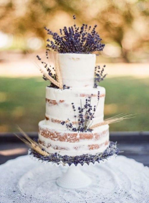 a naked wedding cake with wheat and lavender is a beautiful Provence wedding idea to try