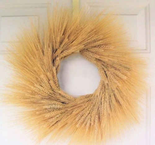a wheat wreath on the door can be a nice decoration for a rustic wedding in summer or fall, hang it anywhere you want
