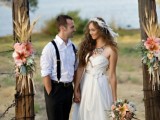 a rustic wedding arch decorated with wheat, pink blooms and greenery is a lovely and cozy idea