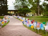 colorful paper hearts on sticks lining up the aisle are a great alternative to usual blooms and greenery