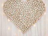an oversized wood slice heart is a gorgeous decor idea for a rustic or woodland wedding, you can make one yourself