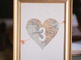 a heart map table number in a gold frame is a cool solution for a traveler wedding and it’s easy to make