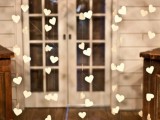 heart buntings and moss monograms will be cool decorations for a rustic wedding