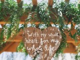 a plywood heart with a quote is a lovely rustic wedding decor idea you can DIY easily