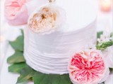 a textural one tier wedding cake topped with fresh and bright blooms is a beautiful idea for a spring or summer wedding