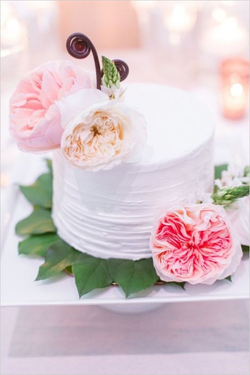 a textural one tier wedding cake topped with fresh and bright blooms is a beautiful idea for a spring or summer wedding