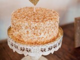 a mille-feuille wedding cake topped with a glitter heart is a fresh take on the traditional dessert