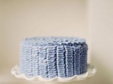 a blue buttercream pattern wedding cake is ideal for a seaside or beach wedding