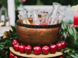 a lovely wedding drink bar decorated with apples