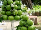 skip wedding cakes and go for glass stands composed of green apples, with white blooms and greenery, this is a very healthy alternative